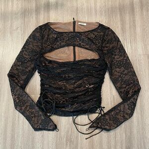 Mistress rocks black lace cut out top